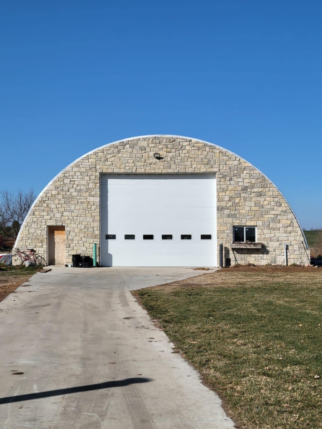 Q Series Quonset agricultural steel building, stone exterior